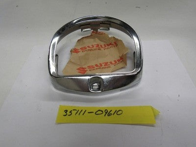 Suzuki T10 & S32-2 nos headlight rim  35111-09610