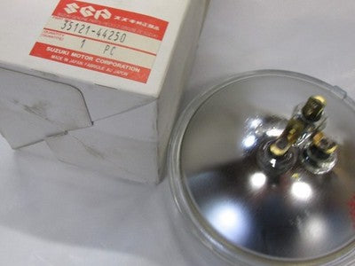 Suzuki 1983-1992 GN125 NOS HEADLIGHT 35121-44250