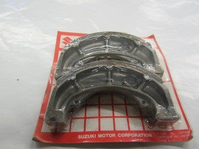 NOS NEW FRONT BRAKE SHOE FITS SUZUKI ATV QUADRUNNER LT160E 2X4 1989-2004 54400-0