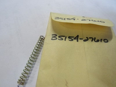NOS SUZUKI  35154-27610 HEADLAMP SPRING  AS50