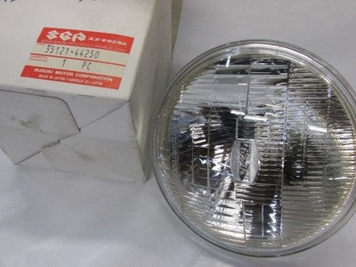 Suzuki 1983-1992 GN125 NOS HEADLIGHT 35121-44250