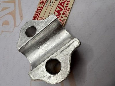 NOS OEM KAWASAKI FORK AXLE HOLDER F11     44063-005