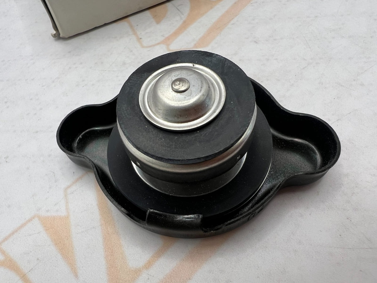 Suzuki NOS OEM radiator cap part numbers 17730-08J00 and 17730-12C20