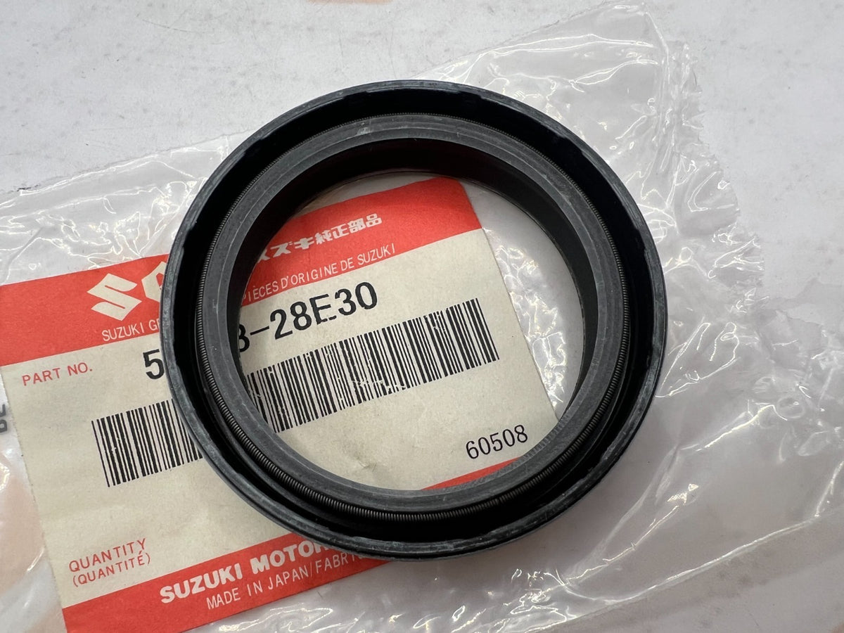 SUZUKI- 51153-28E30- FRONT FORK SEAL 1989-98 RM 125,250  NOS