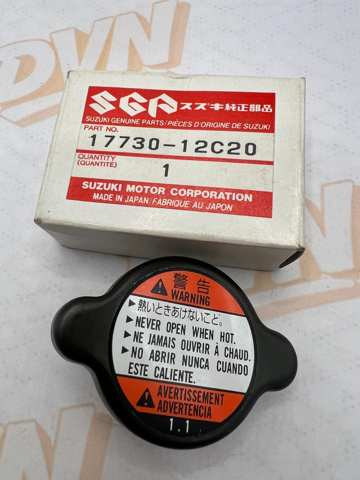 Suzuki NOS OEM radiator cap part numbers 17730-08J00 and 17730-12C20
