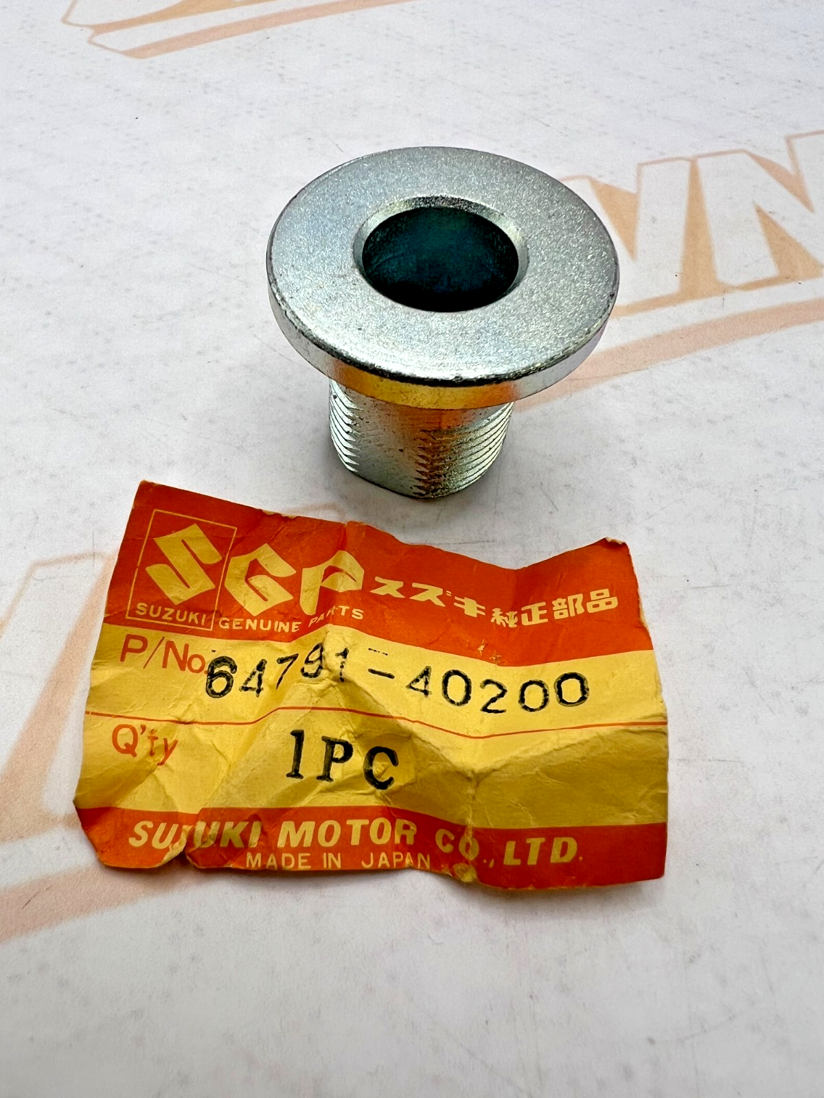 SUZUKI PE175/RM125 RHS CHAIN ADJUSTER SPACER NOS OEM 64791-40200 1980